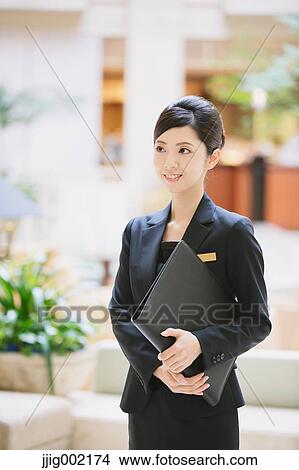 Japanese female hotel concierge View Large Photo Image Picture - Japanese female hotel concierge. Fotosearch