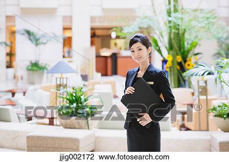 Japanese female hotel concierge View Large Photo Image Stock Image - Japanese female hotel concierge. Fotosearch