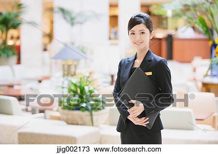 Japanese female hotel concierge View Large Photo Image Stock Image - Japanese female hotel concierge. Fotosearch