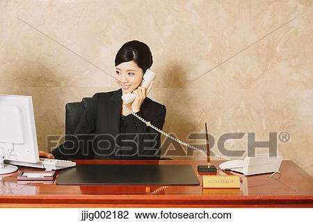Japanese female hotel concierge View Large Photo Image Stock Image - Japanese female hotel concierge. Fotosearch