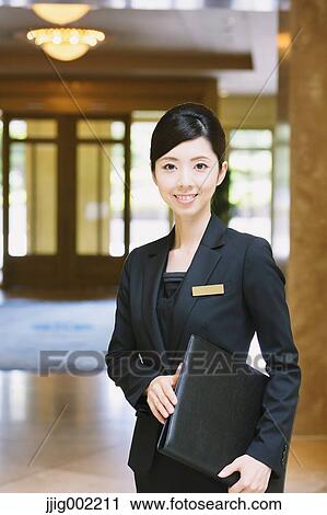 Japanese female hotel concierge View Large Photo Image Stock Image - Japanese female hotel concierge. Fotosearch