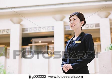 Japanese female hotel concierge View Large Photo Image Stock Image - Japanese female hotel concierge. Fotosearch