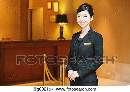 Stock Photo - Japanese female hotel concierge. Fotosearch