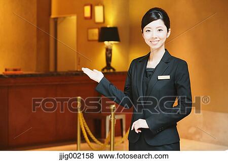 Stock Photo - Japanese female hotel concierge. Fotosearch