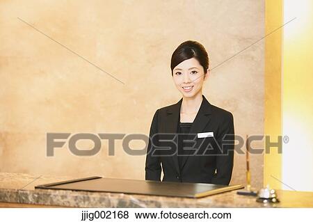 Stock Photo - Japanese female hotel concierge. Fotosearch