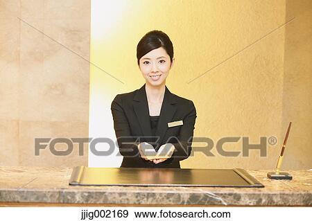 Stock Photo - Japanese female hotel concierge. Fotosearch