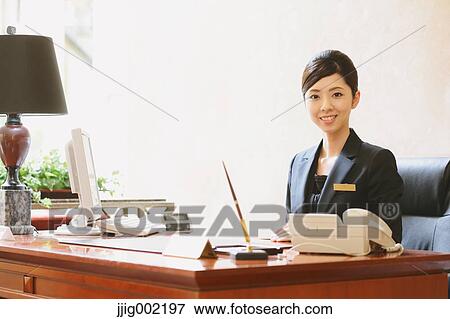 Japanese female hotel concierge View Large Photo Image Stock Photo - Japanese female hotel concierge. Fotosearch