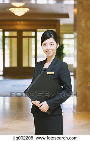 Japanese female hotel concierge View Large Photo Image Stock Photo - Japanese female hotel concierge. Fotosearch