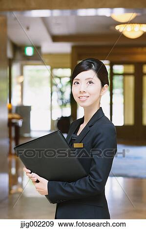 Japanese female hotel concierge View Large Photo Image Stock Photo - Japanese female hotel concierge. Fotosearch