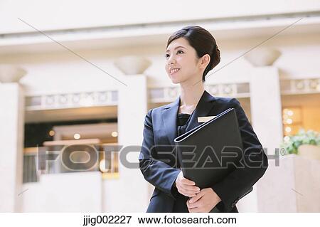 Japanese female hotel concierge View Large Photo Image Stock Photo - Japanese female hotel concierge. Fotosearch