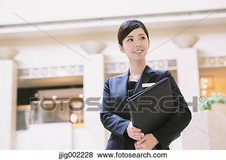 Japanese female hotel concierge View Large Photo Image Stock Photo - Japanese female hotel concierge. Fotosearch