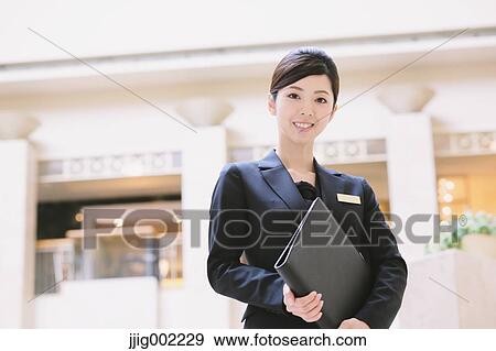 Japanese female hotel concierge View Large Photo Image Stock Photo - Japanese female hotel concierge. Fotosearch