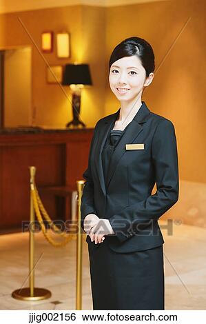 Stock Photograph - Japanese female hotel concierge. Fotosearch