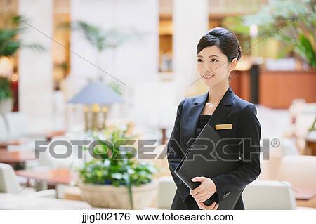 Stock Photograph - Japanese female hotel concierge. Fotosearch
