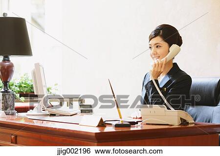 Japanese female hotel concierge View Large Photo Image Stock Photograph - Japanese female hotel concierge. Fotosearch