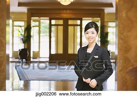 Japanese female hotel concierge View Large Photo Image Stock Photograph - Japanese female hotel concierge. Fotosearch