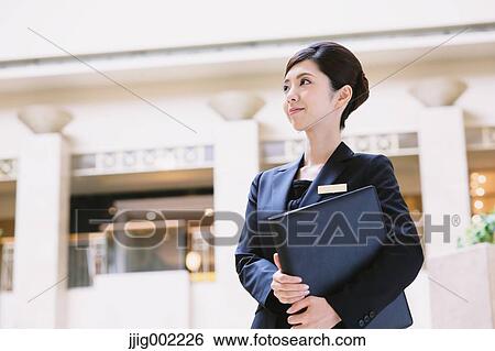 Japanese female hotel concierge View Large Photo Image Stock Photograph - Japanese female hotel concierge. Fotosearch