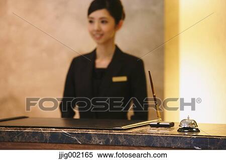 Stock Photography - Japanese female hotel concierge. Fotosearch