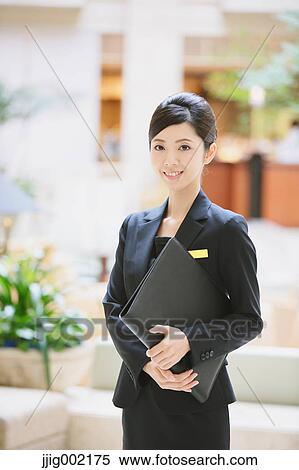 Japanese female hotel concierge View Large Photo Image Stock Photography - Japanese female hotel concierge. Fotosearch