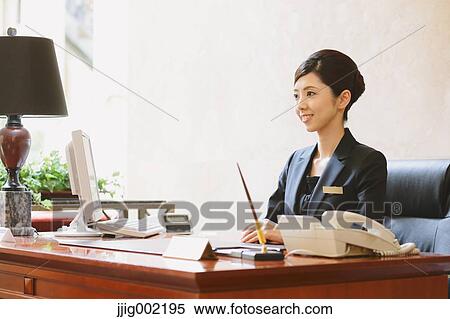 Japanese female hotel concierge View Large Photo Image Stock Photography - Japanese female hotel concierge. Fotosearch