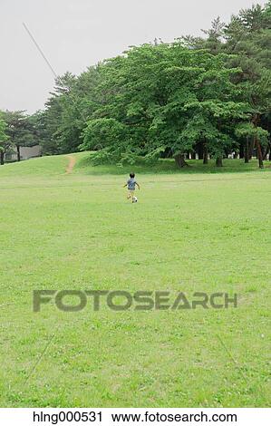 Japanese kid playing in a park View Large Photo Image Stock Image - Japanese kid playing in a park. Fotosearch