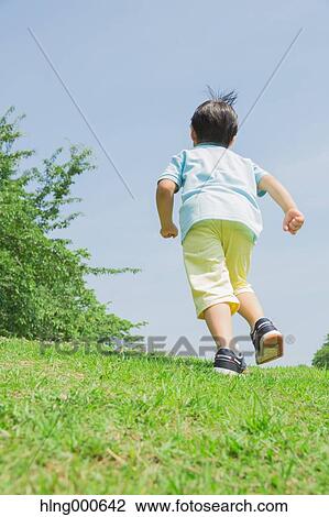 Japanese kid playing in a park View Large Photo Image Stock Image - Japanese kid playing in a park. Fotosearch