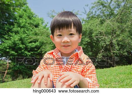 Stock Image - Japanese kid playing in a park. Fotosearch