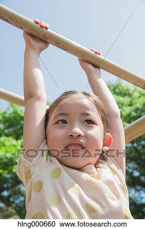 Japanese kid playing in a park View Large Photo Image Stock Image - Japanese kid playing in a park. Fotosearch