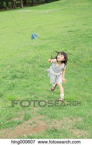 Japanese kid playing in a park View Large Photo Image Stock Photo - Japanese kid playing in a park. Fotosearch