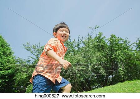 Japanese kid playing in a park View Large Photo Image Stock Photo - Japanese kid playing in a park. Fotosearch