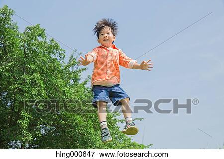 Japanese kid playing in a park View Large Photo Image Stock Photo - Japanese kid playing in a park. Fotosearch