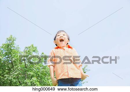 Stock Photo - Japanese kid playing in a park. Fotosearch