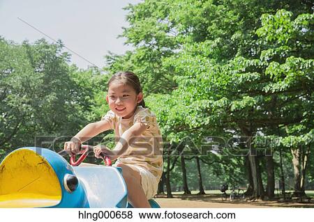 Japanese kid playing in a park View Large Photo Image Stock Photo - Japanese kid playing in a park. Fotosearch