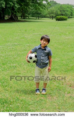 Japanese kid playing in a park View Large Photo Image Stock Photograph - Japanese kid playing in a park. Fotosearch