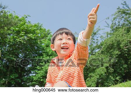Stock Photography - Japanese kid playing in a park. Fotosearch
