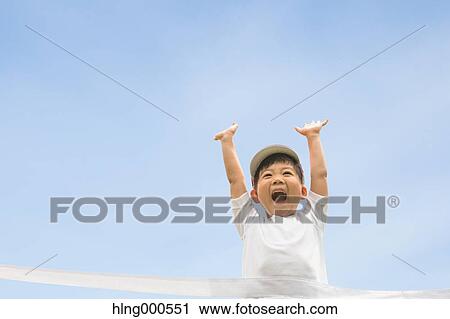 Japanese kid running in a park View Large Photo Image Stock Image - Japanese kid running in a park. Fotosearch