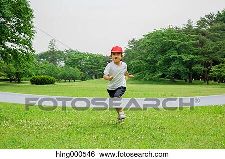 Japanese kid running in a park View Large Photo Image Stock Photograph - Japanese kid running in a park. Fotosearch