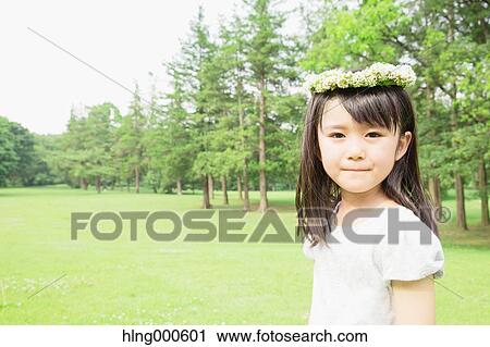 Japanese kid with flower tiara in a park View Large Photo Image Stock Image - Japanese kid with flower tiara in a park. Fotosearch