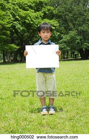 Japanese kid with whiteboard in a park View Large Photo Image Stock Image - Japanese kid with whiteboard in a park. Fotosearch