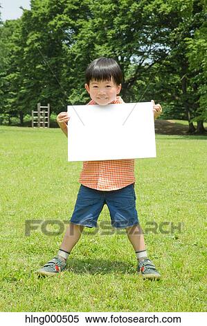 Japanese kid with whiteboard in a park View Large Photo Image Stock Photography - Japanese kid with whiteboard in a park. Fotosearch