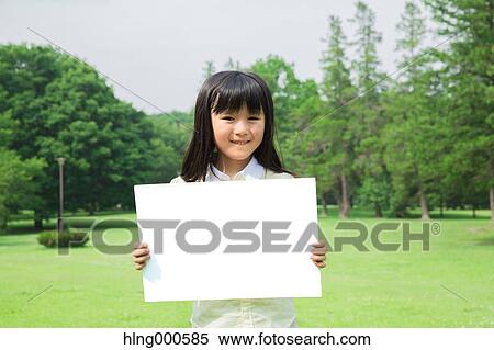 Japanese kid with whiteboard in a park View Large Photo Image Stock Photography - Japanese kid with whiteboard in a park. Fotosearch