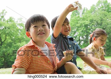 Japanese kids having picnic in a park View Large Photo Image Picture - Japanese kids having picnic in a park. Fotosearch
