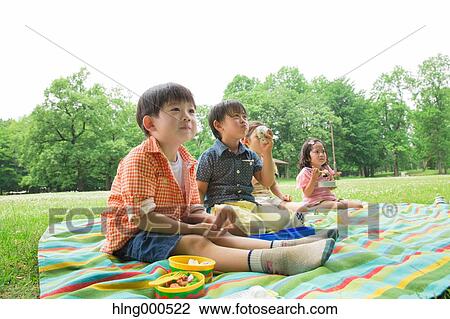 Japanese kids having picnic in a park View Large Photo Image Stock Image - Japanese kids having picnic in a park. Fotosearch