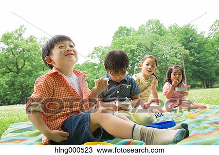 Japanese kids having picnic in a park View Large Photo Image Stock Image - Japanese kids having picnic in a park. Fotosearch