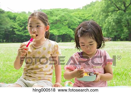 Japanese kids having picnic in a park View Large Photo Image Stock Photo - Japanese kids having picnic in a park. Fotosearch