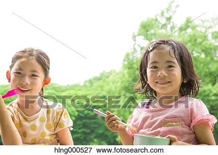 Japanese kids having picnic in a park View Large Photo Image Stock Photo - Japanese kids having picnic in a park. Fotosearch