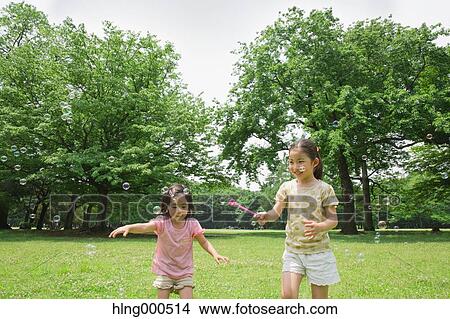 Japanese kids playing in a park View Large Photo Image Picture - Japanese kids playing in a park. Fotosearch