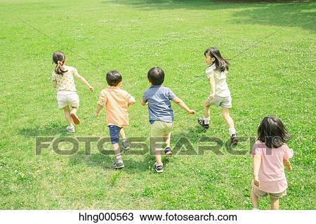 Japanese kids playing in a park View Large Photo Image Stock Image - Japanese kids playing in a park. Fotosearch