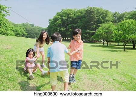 Japanese kids playing in a park View Large Photo Image Stock Image - Japanese kids playing in a park. Fotosearch