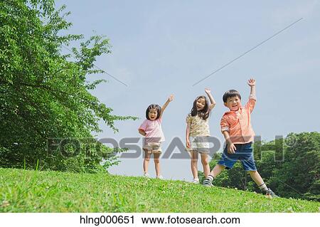 Japanese kids playing in a park View Large Photo Image Stock Image - Japanese kids playing in a park. Fotosearch